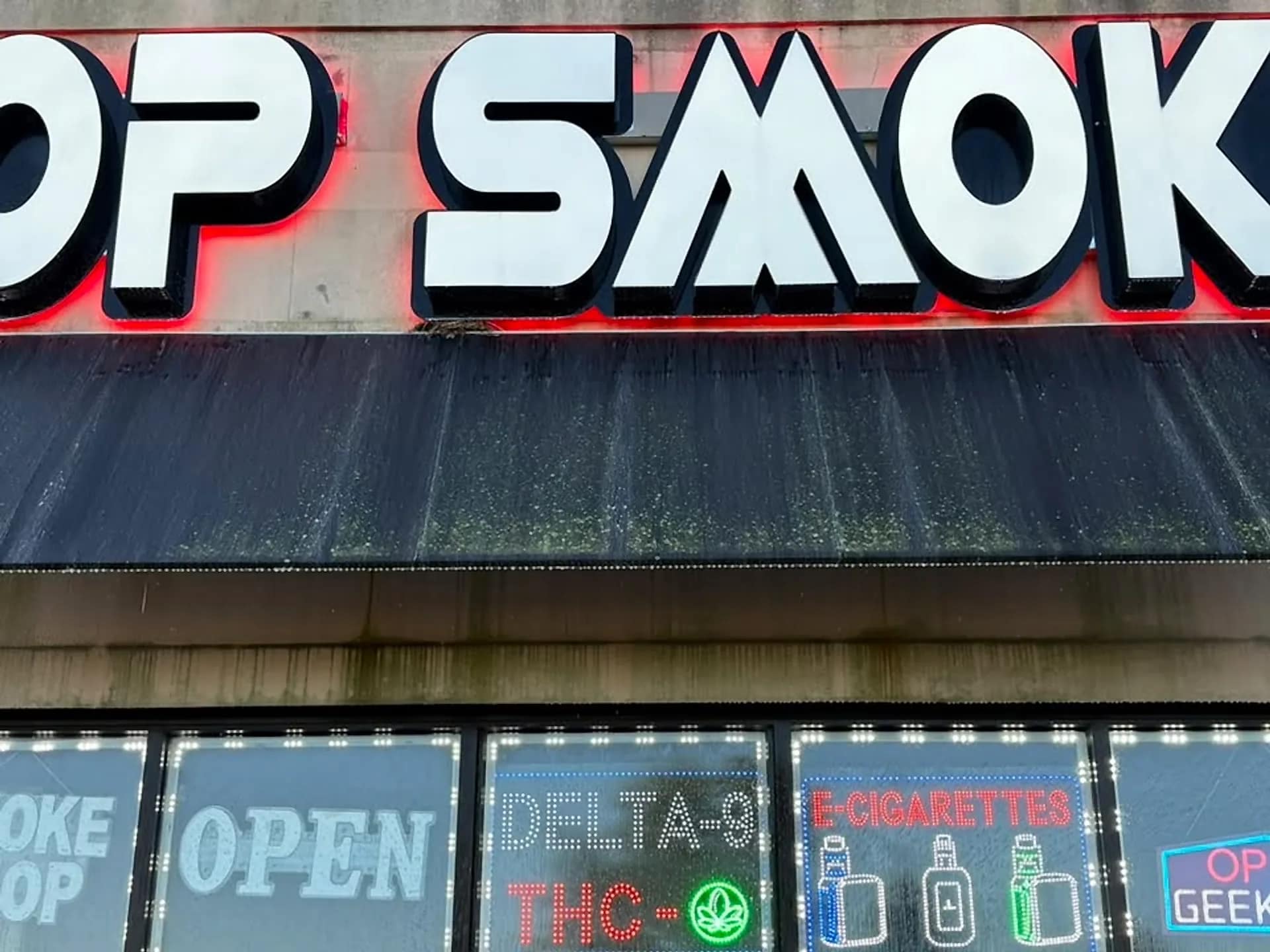 Storefront windows and sign after washing, glass clear to the display inside