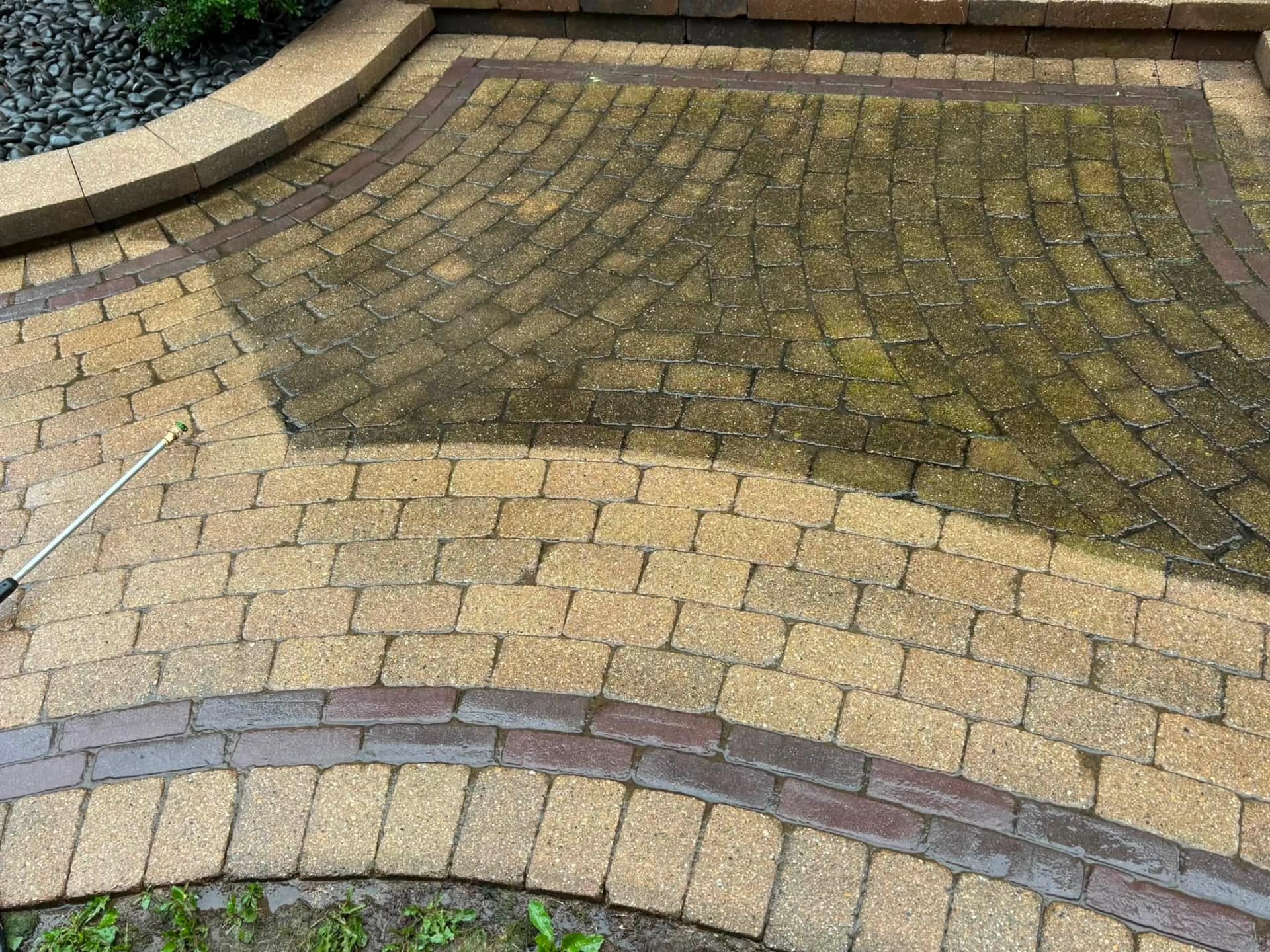 Brick paver walkway washed clean, curve of the path fully restored