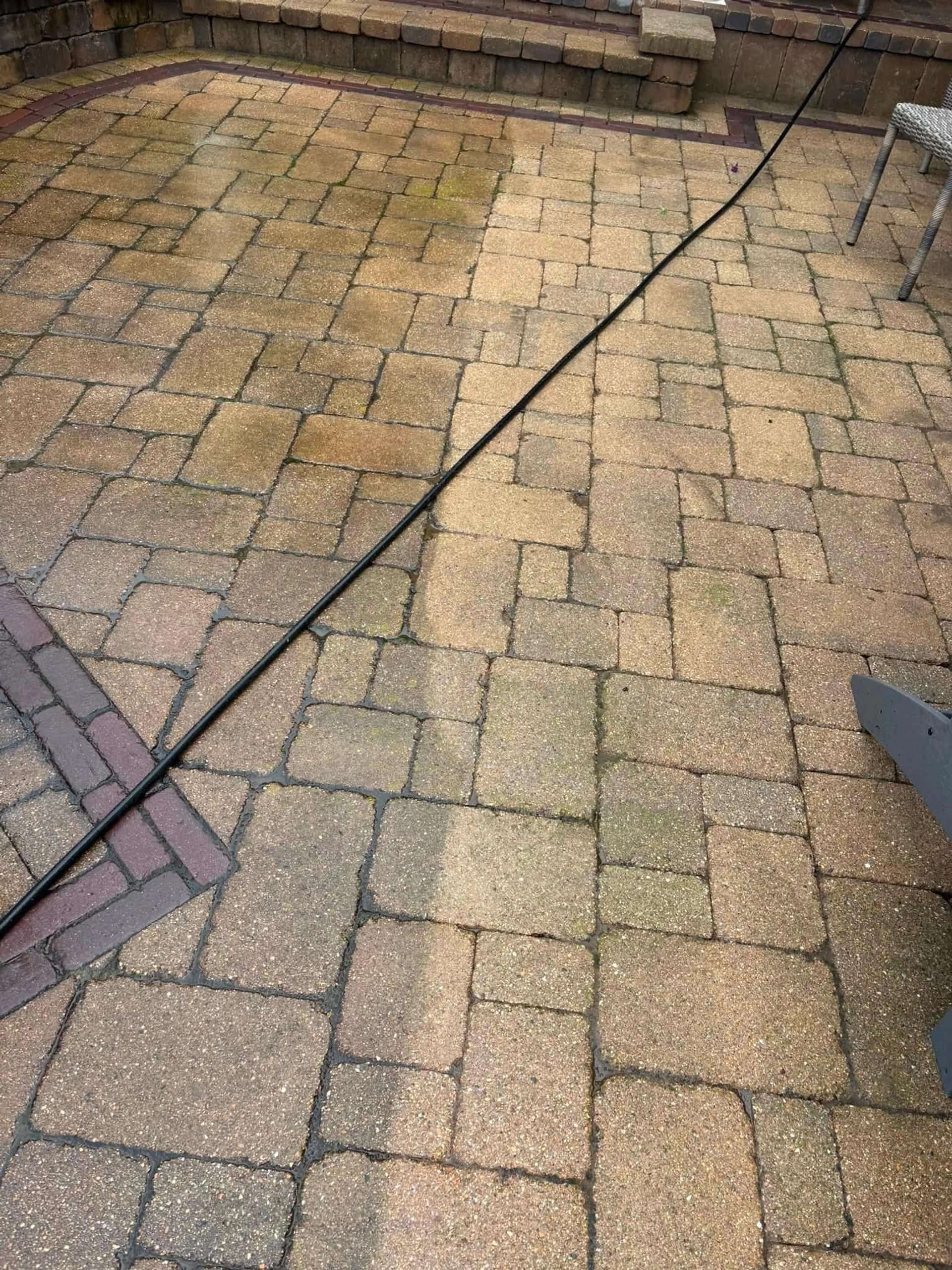 Paver patio washed clean around the seating area